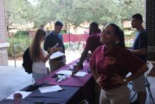 students browsing a table
