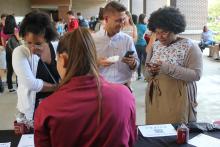 students browsing a table