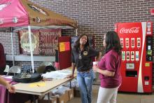 students browsing tables at an event