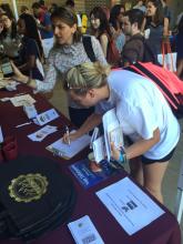 students browsing a table