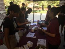students browsing a table