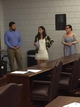 three students talking