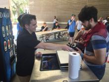 students browsing a table