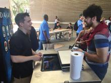 students browsing a table
