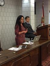 students speaking behind a podium