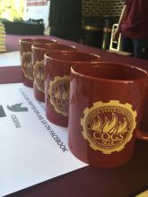 cups with the COGS logo