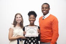 three people posing for a picture together