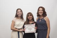 three people posing for a picture together
