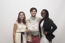 three people posing for a picture together