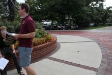 students walking away from the integration statue