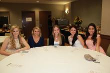 group of people sitting around a table