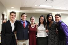 group of people standing together posing