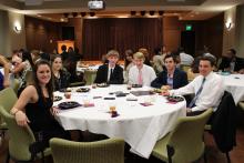 group of people sitting around a table