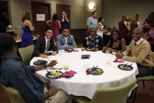 group of people sitting around a table