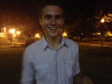 smiling man at night