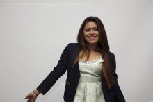 woman standing in front of a white background