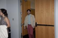 people walking through a doorway