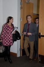 people walking through a doorway