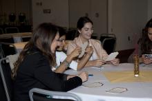 people sitting at a table eating