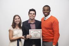 three people posing for a picture together