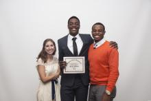 three people posing for a picture together