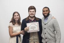 three people posing for a picture together