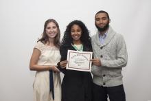 three people posing for a picture together
