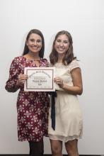 two people posing for a picture together