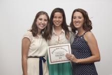 three people posing for a picture together