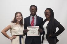 three people posing for a picture together