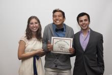 three people posing for a picture together