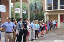 long line of students waiting outside