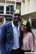 man and a woman posing together with sticky notes on their forehead