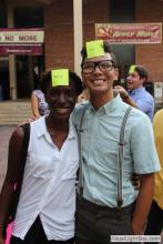man and a woman posing together with sticky notes on their forehead