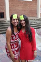 two women posing together with sticky notes on their forehead